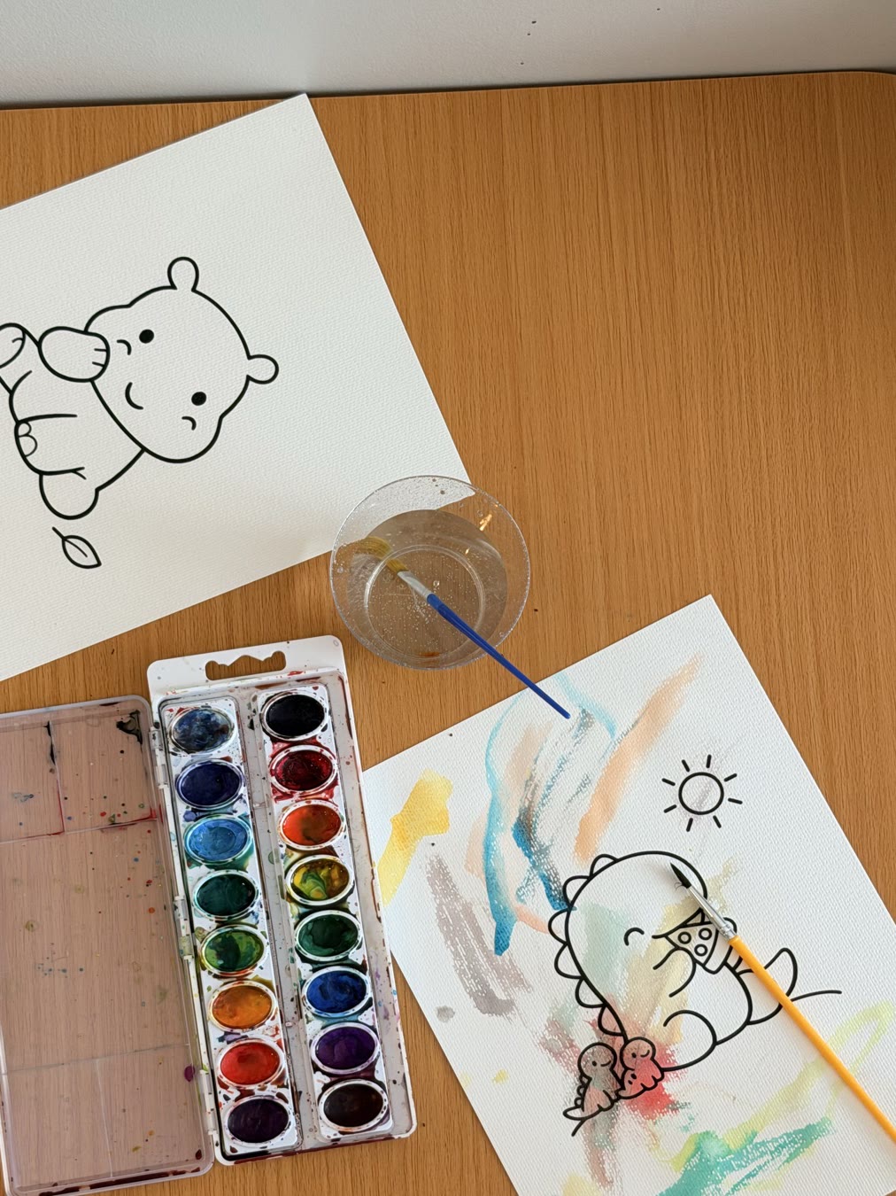 A watercolor painting project set up at home